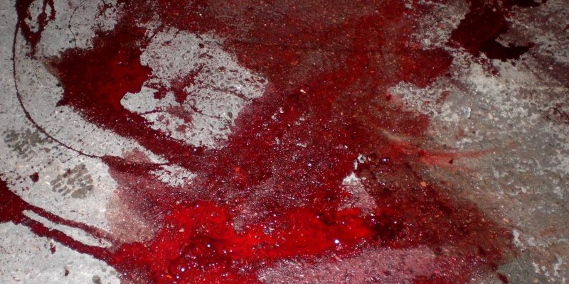 a blood on the concrete